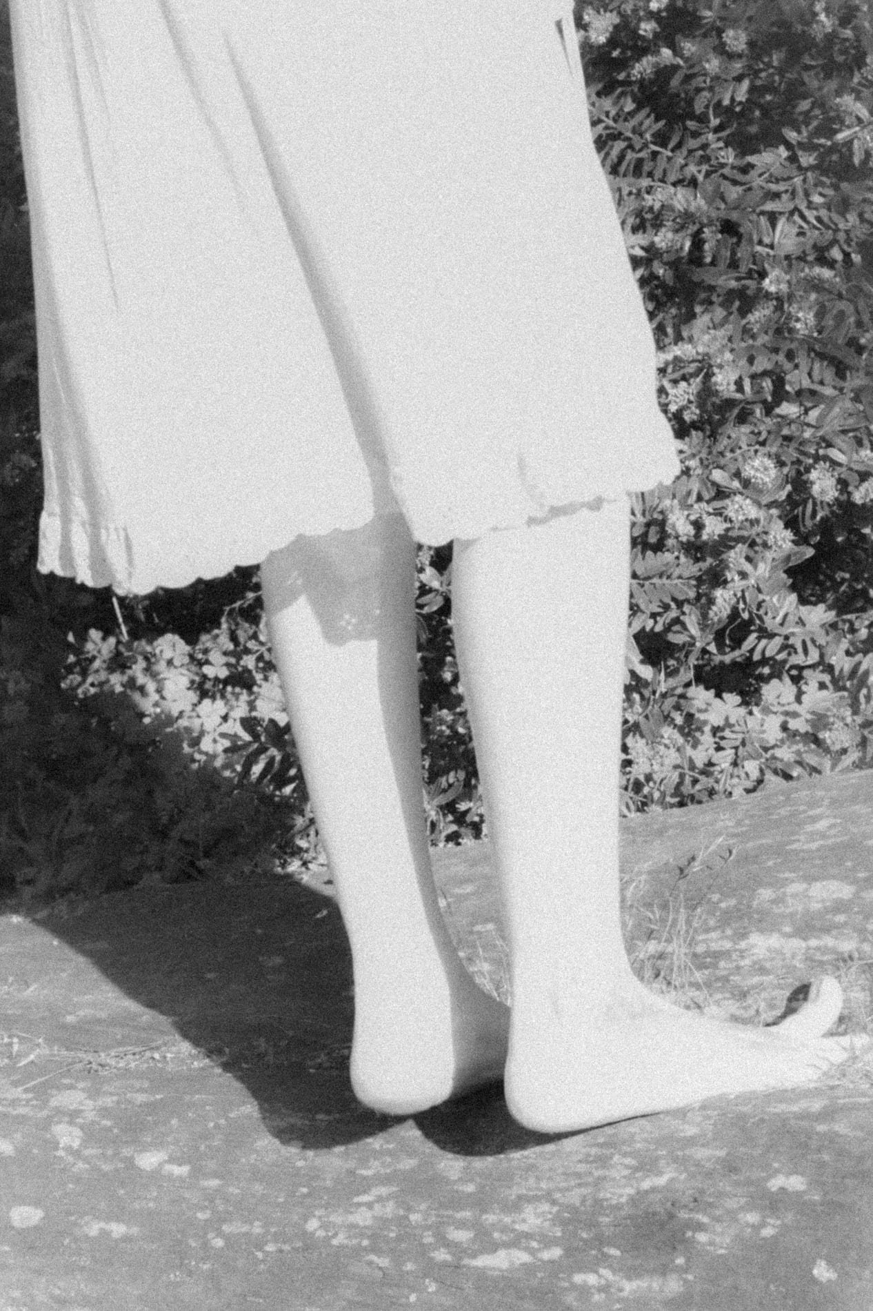 Legs and dress hem, black and white