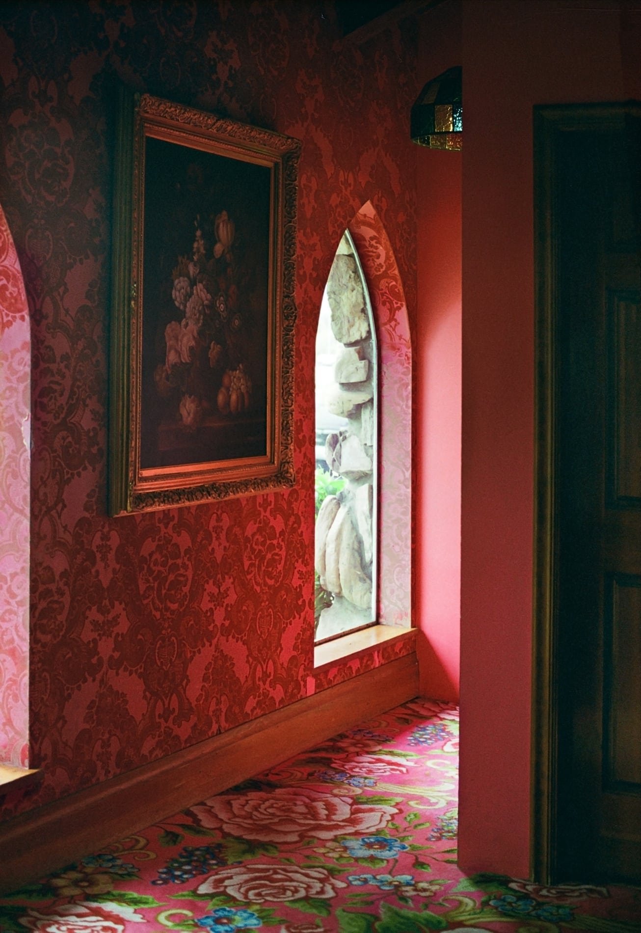 Ornate red wallpapered room